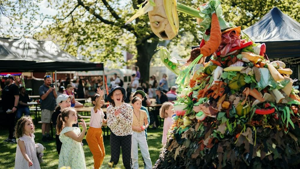 Large material puppet made to look like living compost heap delights young children