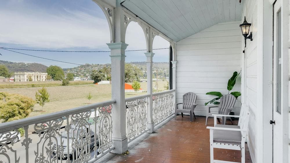 Balcony with seating and view over Launceston