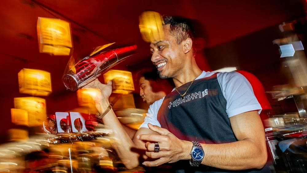 Bar staff making drinks